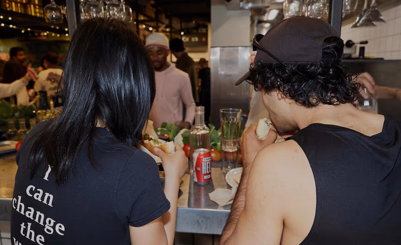 Miznon team members at the restaurant counter